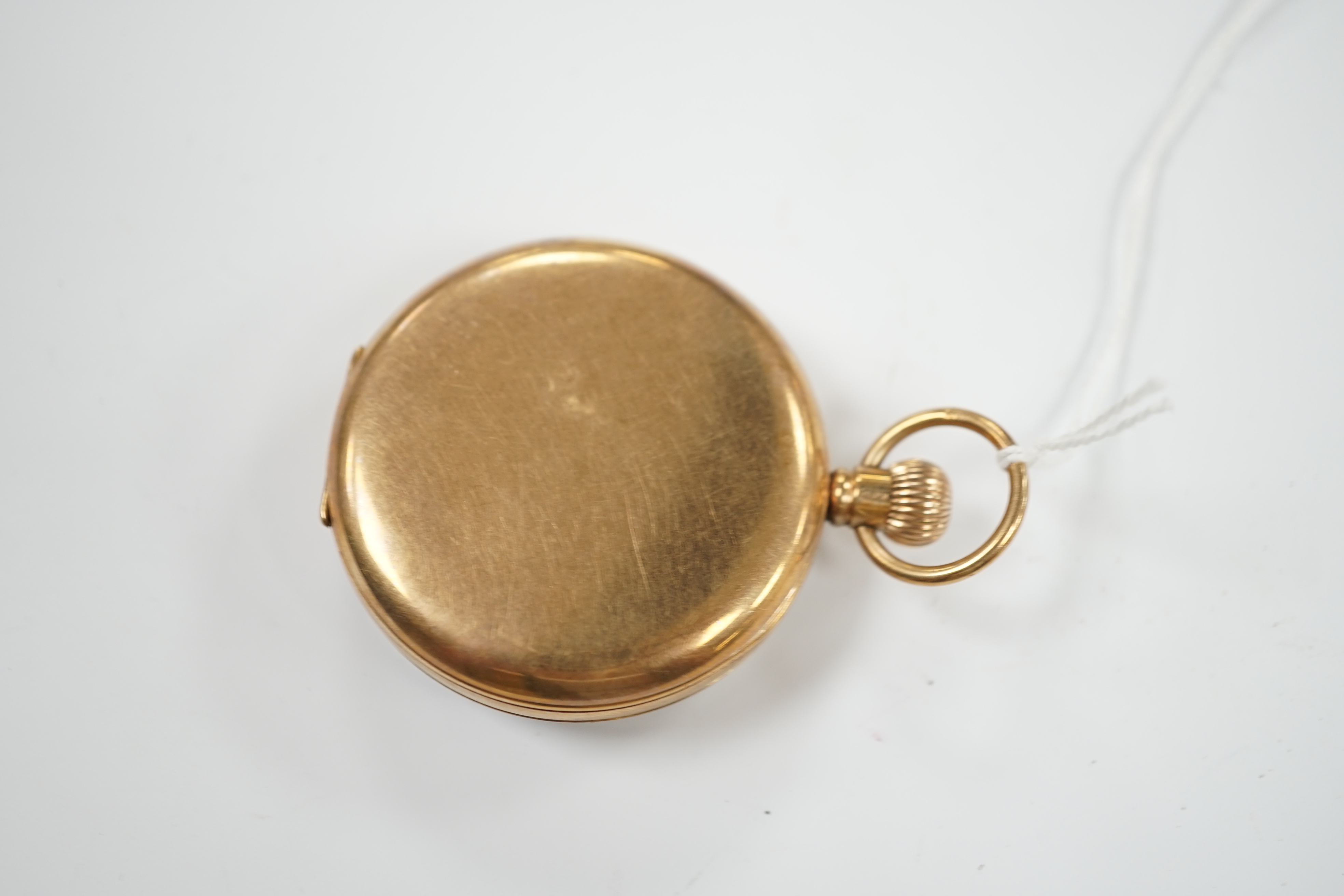 A George V 9ct gold open face keyless pocket watch, with Roman dial and subsidiary seconds, case diameter 48mm, gross weight 78.9 grams.